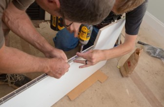How to Build a TV Lift Discreetly Tucked Behind a Fireplace Mantel